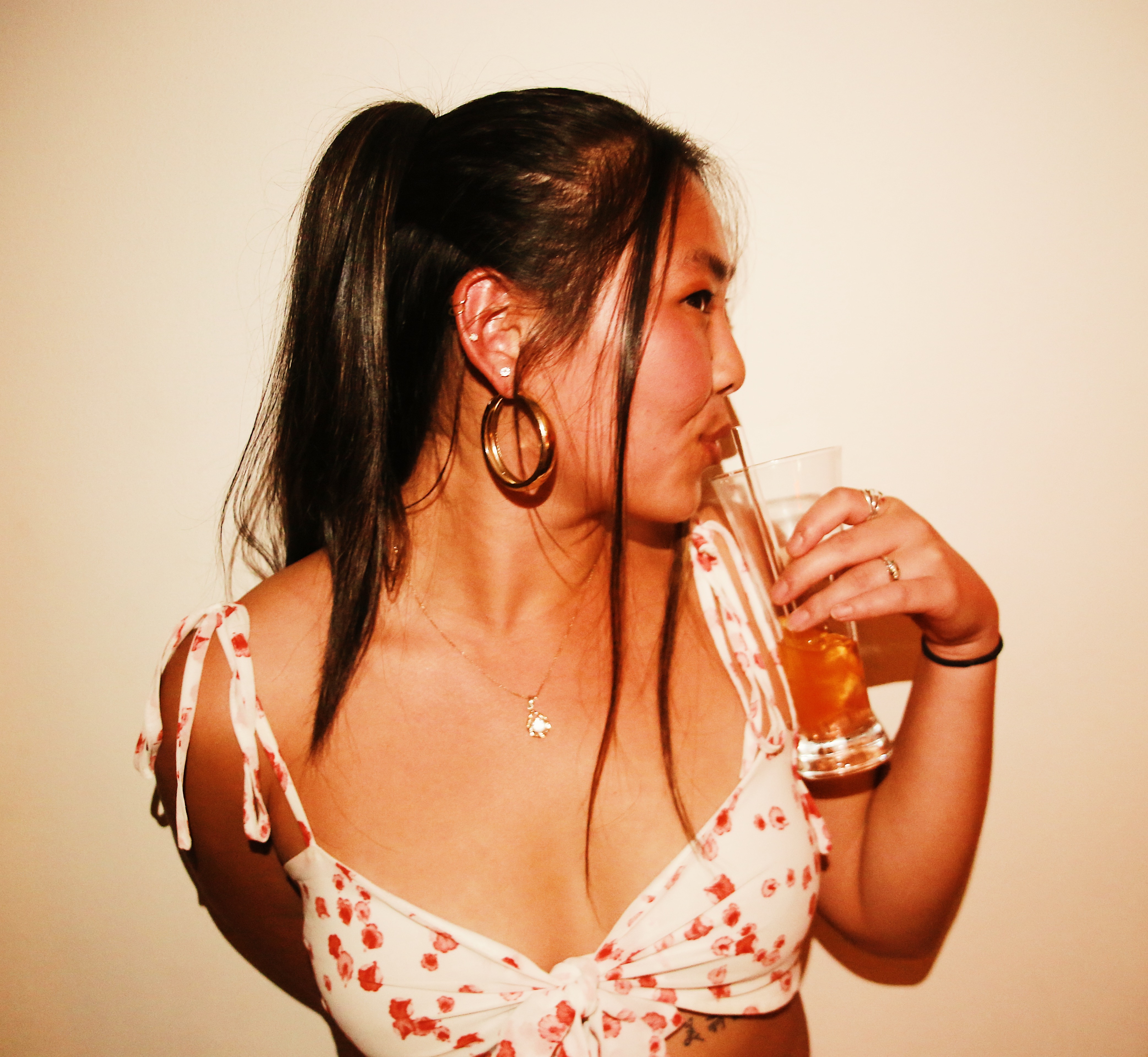 A beautiful girl enjoys her drink